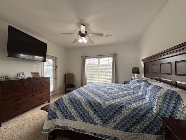330 S Wildwood Dr Unit B1, Branson, MO 65616 - bedroom with light carpet, multiple windows, and ceiling fan