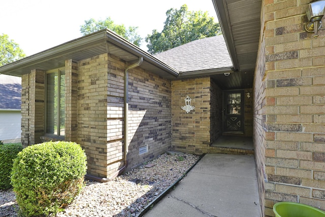 3723 N Vera Cruz Dr, Springfield, MO 65803 - entrance to property featuring a shingled roof and brick siding