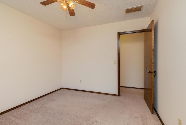 3723 N Vera Cruz Dr, Springfield, MO 65803 - carpeted spare room featuring a ceiling fan and a textured ceiling