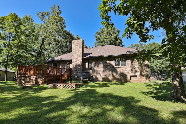 3723 N Vera Cruz Dr, Springfield, MO 65803 - back of property with a chimney, a deck, brick siding, and roof with shingles