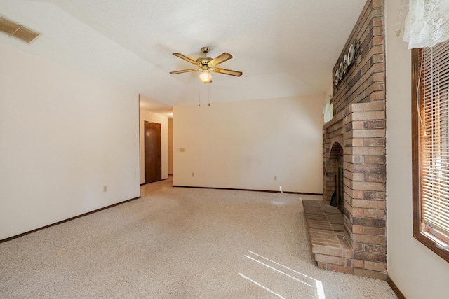 3723 N Vera Cruz Dr, Springfield, MO 65803 - unfurnished living room featuring ceiling fan, a brick fireplace, and light colored carpet