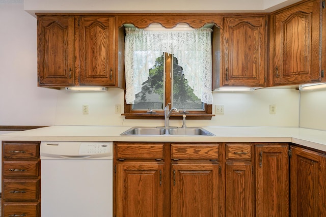 3723 N Vera Cruz Dr, Springfield, MO 65803 - kitchen with dishwasher, light countertops, and brown cabinets