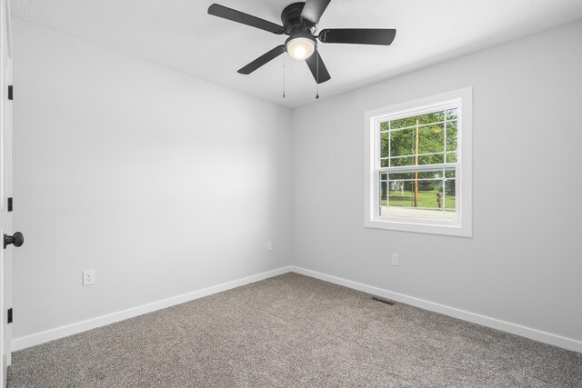 407 W Adamson St, Miller, MO 65707 - carpeted empty room with baseboards and a ceiling fan