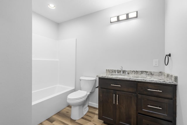 407 W Adamson St, Miller, MO 65707 - full bathroom featuring vanity, wood finished floors, and shower / washtub combination