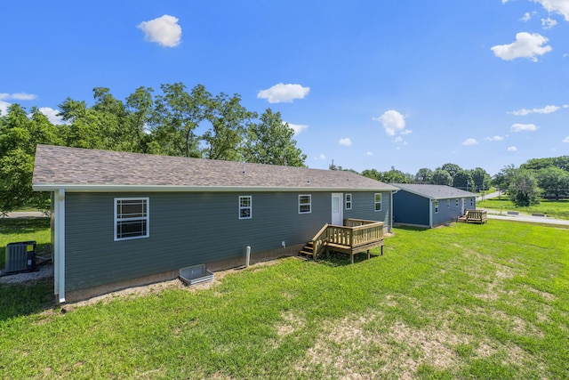 407 W Adamson St, Miller, MO 65707 - back of property featuring a wooden deck and a lawn