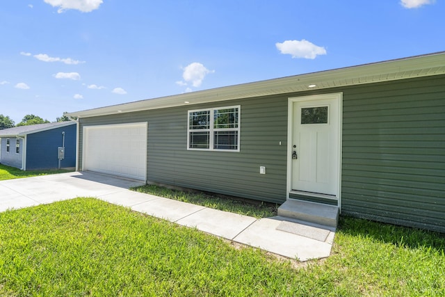 407 W Adamson St, Miller, MO 65707 - view of front of house featuring driveway, an attached garage, and a front lawn