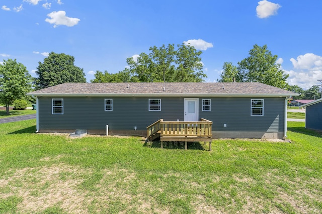 407 W Adamson St, Miller, MO 65707 - back of property with a lawn and a deck