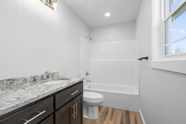 407 W Adamson St, Miller, MO 65707 - bathroom with wood finished floors, vanity, and bathing tub / shower combination