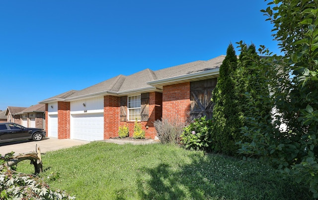 5441 Basswood Ct W, Springfield, MO 65802 - view of front of house with brick siding, a garage, a front lawn, concrete driveway, and roof with shingles