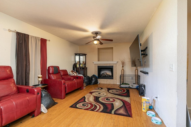 5441 Basswood Ct W, Springfield, MO 65802 - living area featuring wood finished floors, ceiling fan, and a tile fireplace