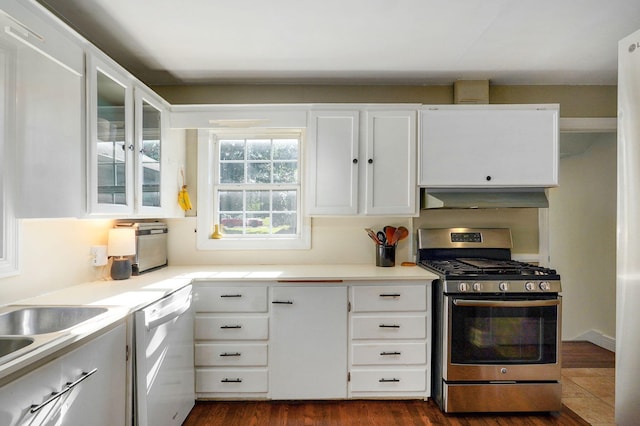 223 E Silsby St, Springfield, MO 65807 - kitchen with stainless steel gas stove, white dishwasher, under cabinet range hood, and white cabinetry