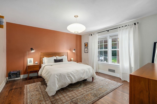 223 E Silsby St, Springfield, MO 65807 - bedroom with baseboards and wood finished floors