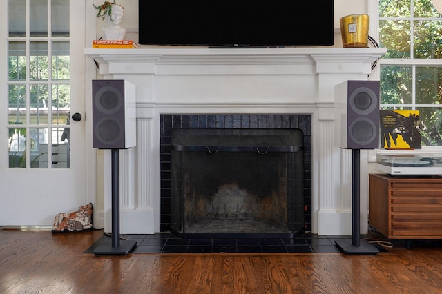 223 E Silsby St, Springfield, MO 65807 - detailed view of a brick fireplace and wood finished floors