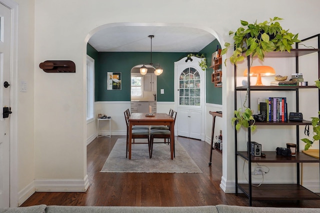 223 E Silsby St, Springfield, MO 65807 - dining room with arched walkways, wood finished floors, and wainscoting