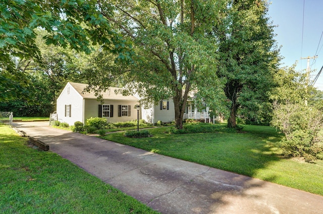 223 E Silsby St, Springfield, MO 65807 - view of front of house featuring concrete driveway and a front yard