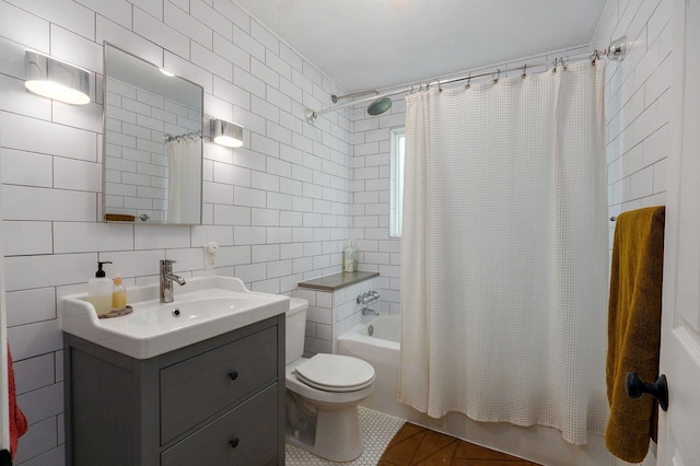 223 E Silsby St, Springfield, MO 65807 - bathroom with tile walls, vanity, shower / tub combo, tile patterned floors, and decorative backsplash