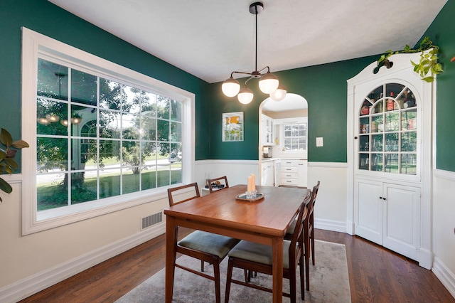 223 E Silsby St, Springfield, MO 65807 - dining space featuring dark wood-style floors and a chandelier