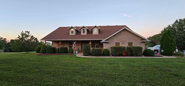 106 Finch Dr, Strafford, MO 65757 - view of front of property with a front lawn, brick siding, and a porch