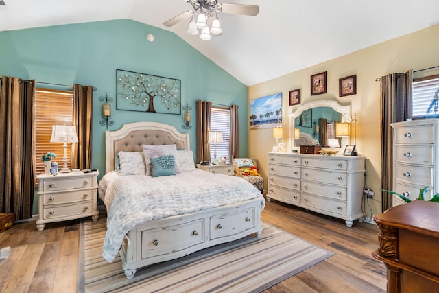 106 Finch Dr, Strafford, MO 65757 - bedroom featuring lofted ceiling, multiple windows, wood finished floors, and a ceiling fan