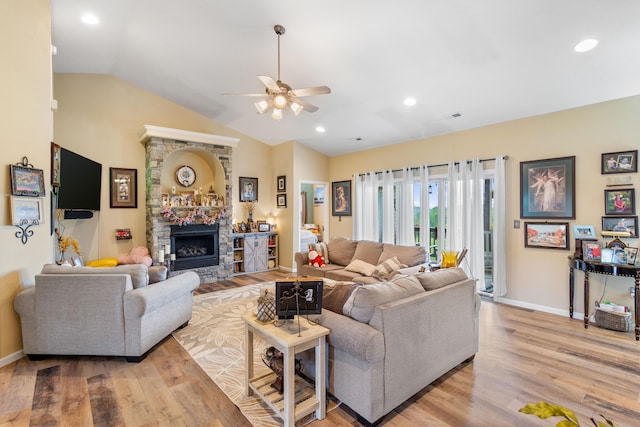 106 Finch Dr, Strafford, MO 65757 - living area featuring ceiling fan, light wood finished floors, a stone fireplace, vaulted ceiling, and recessed lighting