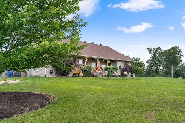 106 Finch Dr, Strafford, MO 65757 - back of house with a lawn and roof with shingles