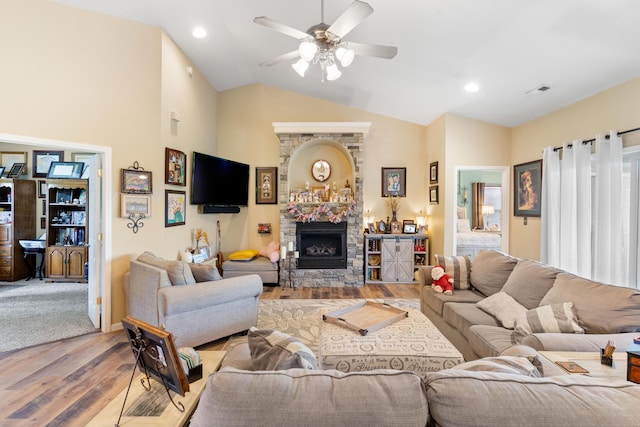 106 Finch Dr, Strafford, MO 65757 - living area with wood finished floors, ceiling fan, a fireplace, lofted ceiling, and recessed lighting