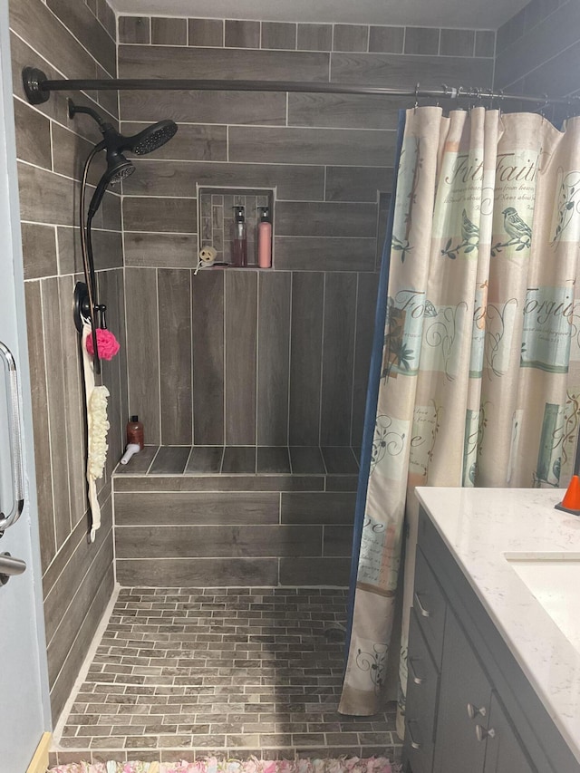 4811 State Route Cc, West Plains, MO 65775 - bathroom featuring tiled shower, vanity, and brick patterned floors