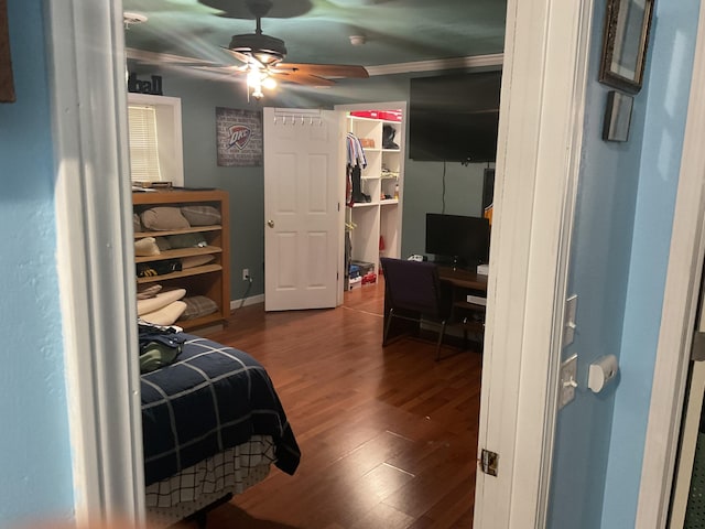 4811 State Route Cc, West Plains, MO 65775 - bedroom featuring wood finished floors, a desk, a spacious closet, crown molding, and a closet