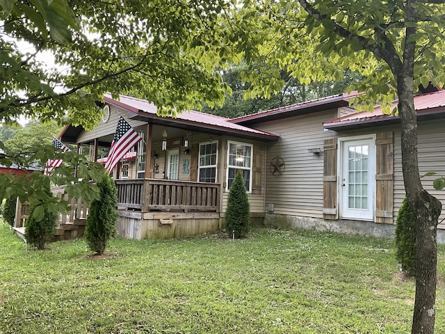 4811 State Route Cc, West Plains, MO 65775 - view of front of house featuring a front yard, a porch, and a metal roof