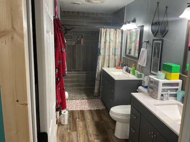 4811 State Route Cc, West Plains, MO 65775 - full bathroom featuring wood finished floors, vanity, and a tile shower