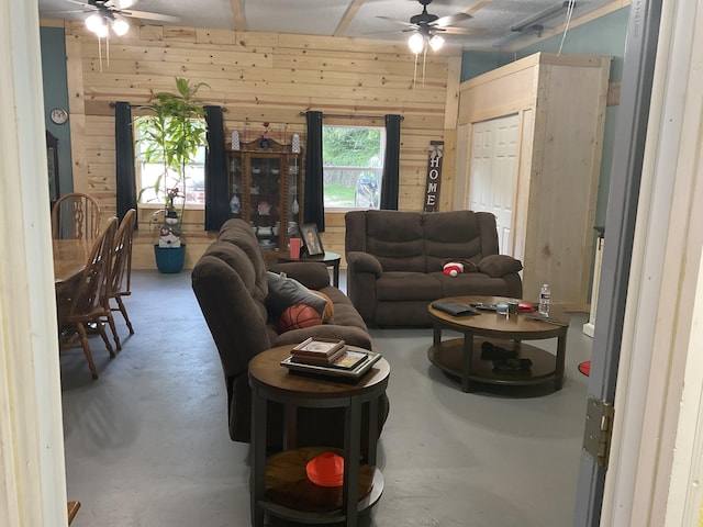 4811 State Route Cc, West Plains, MO 65775 - living area with ceiling fan, concrete floors, and wooden walls