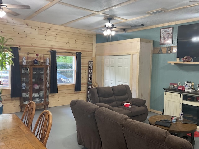 4811 State Route Cc, West Plains, MO 65775 - living area with ceiling fan, wood walls, and finished concrete floors