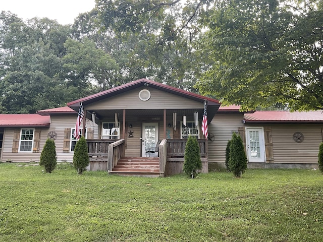 4811 State Route Cc, West Plains, MO 65775 - view of front of house featuring a front yard, a metal roof, and a porch