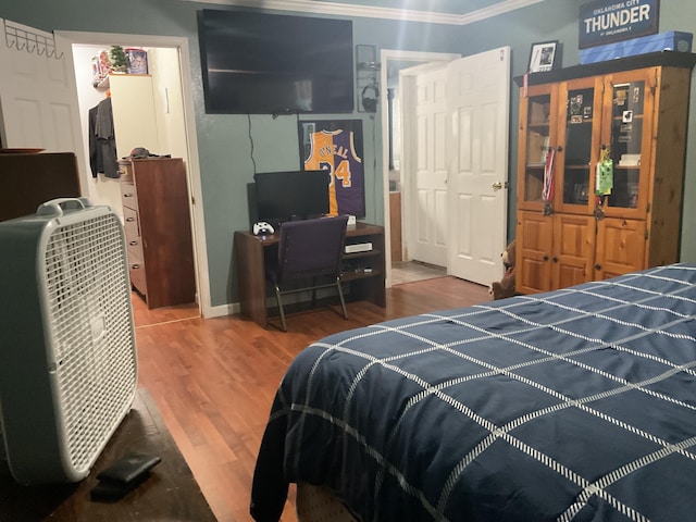4811 State Route Cc, West Plains, MO 65775 - bedroom with ornamental molding, wood finished floors, and a closet