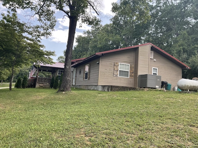 4811 State Route Cc, West Plains, MO 65775 - view of side of property with a lawn and a cooling unit