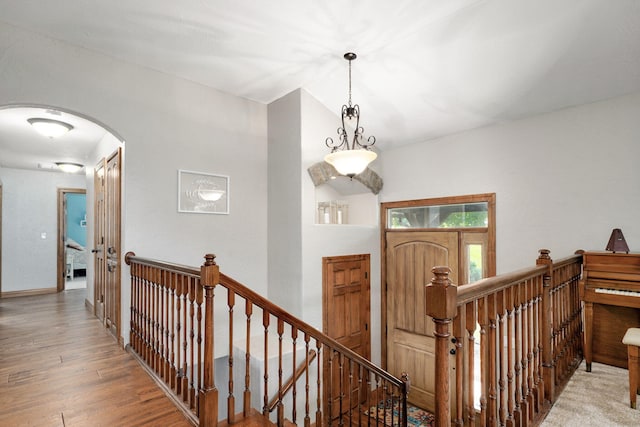 623 E Weaver Rd, Springfield, MO 65810 - hallway with an upstairs landing, arched walkways, and wood finished floors