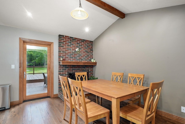 623 E Weaver Rd, Springfield, MO 65810 - dining area featuring hardwood / wood-style floors and a brick fireplace