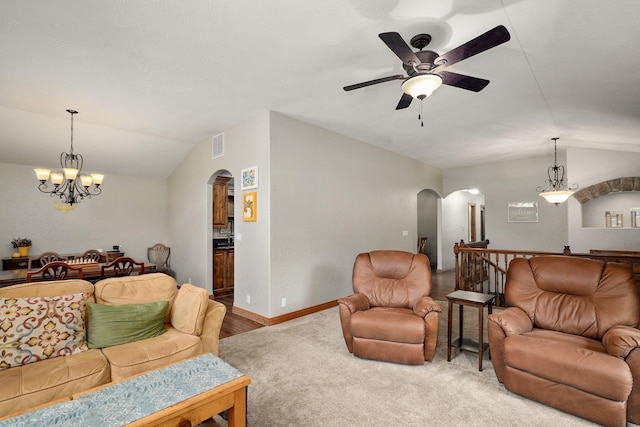 623 E Weaver Rd, Springfield, MO 65810 - living room featuring arched walkways, lofted ceiling, ceiling fan, a chandelier, and carpet floors