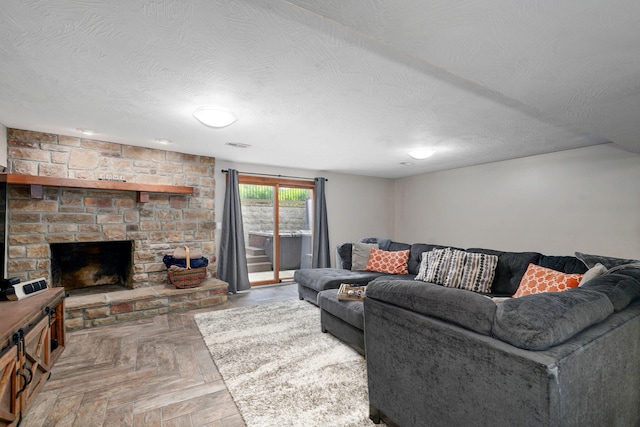 623 E Weaver Rd, Springfield, MO 65810 - living area with a textured ceiling and a fireplace
