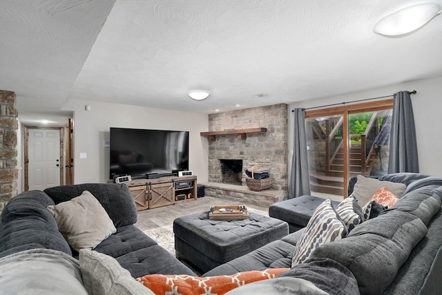 623 E Weaver Rd, Springfield, MO 65810 - living room featuring a stone fireplace and wood finished floors