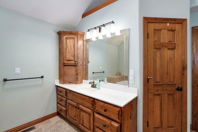 623 E Weaver Rd, Springfield, MO 65810 - bathroom featuring vaulted ceiling and vanity