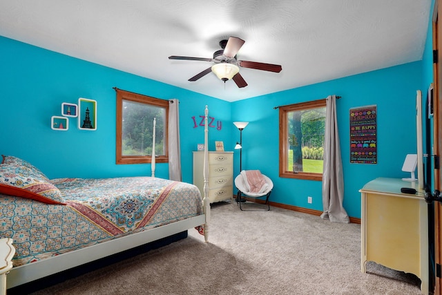 623 E Weaver Rd, Springfield, MO 65810 - carpeted bedroom with multiple windows and ceiling fan