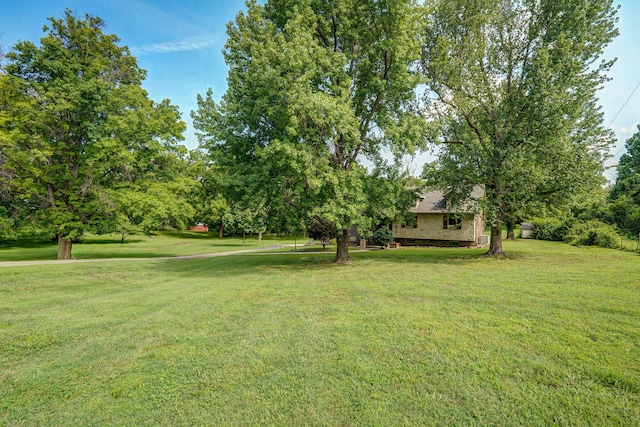 623 E Weaver Rd, Springfield, MO 65810 - view of grassy yard with view of wooded area