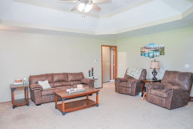 258 State Highway 32, Buffalo, MO 65622 - living area with carpet, a tray ceiling, and a ceiling fan
