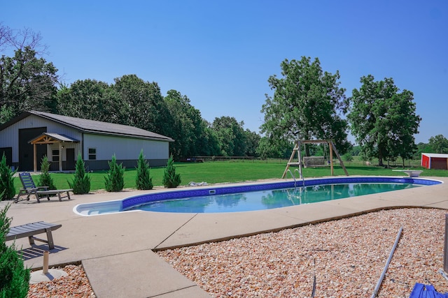258 State Highway 32, Buffalo, MO 65622 - outdoor pool with an outbuilding, a yard, a playground, a diving board, and a patio