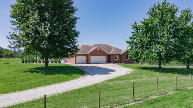 258 State Highway 32, Buffalo, MO 65622 - view of front of home with an attached garage, brick siding, and gravel driveway