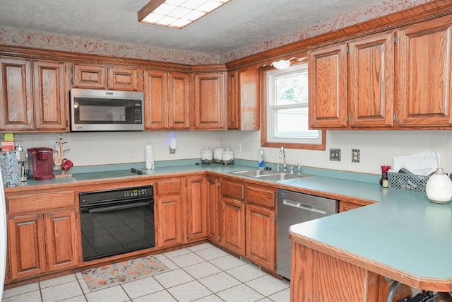 258 State Highway 32, Buffalo, MO 65622 - kitchen with stainless steel appliances, brown cabinetry, light countertops, and light tile patterned floors