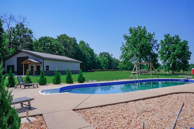 258 State Highway 32, Buffalo, MO 65622 - swimming pool featuring a playground, a yard, a patio area, a diving board, and view of scattered trees