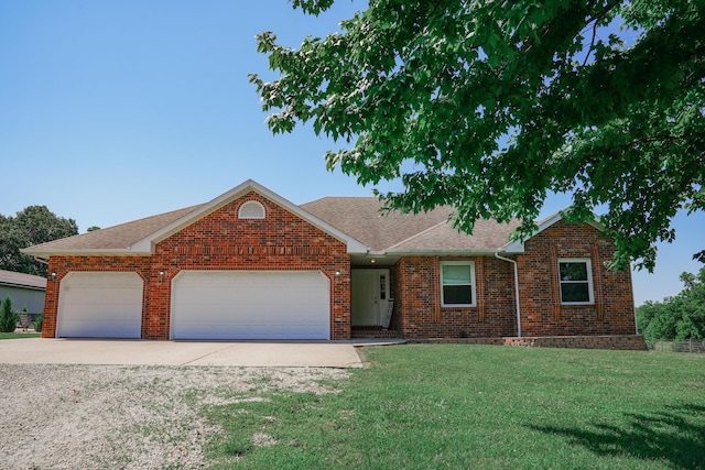 258 State Highway 32, Buffalo, MO 65622 - view of front facade featuring driveway, a front lawn, brick siding, a garage, and roof with shingles