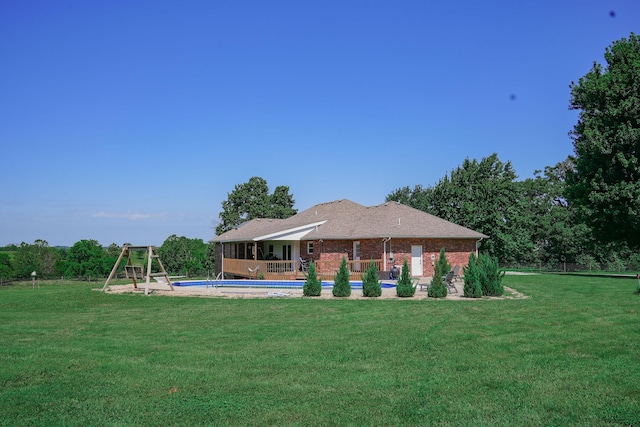 258 State Highway 32, Buffalo, MO 65622 - back of property with an outdoor pool, a lawn, and brick siding
